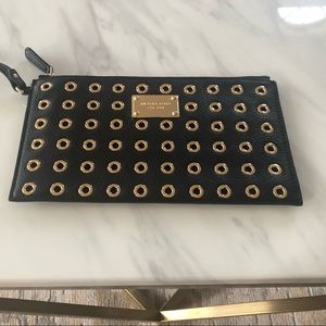 Michael Kors leather and grommet wristlet